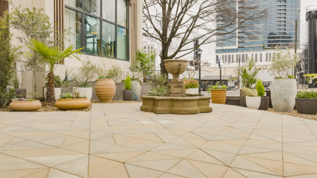 patio with pavers and potted plants