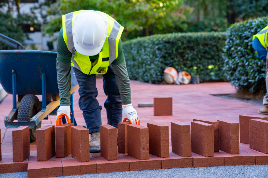 worker layer red brick pavers